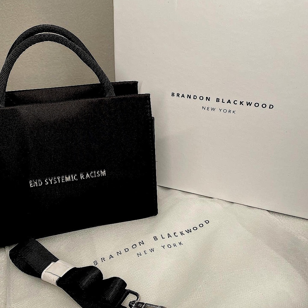 BRANDON BLACKWOOD “END SYSTEMIC RACISM”  1ST EDITION BLACK SATIN PURSE.